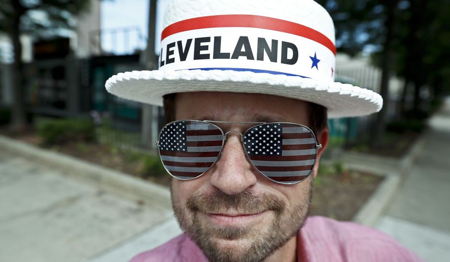 Andy Sandy wears an RNC hat and pair of American flag glasses while walking around, Sunday, July 17, 2016, in Cleveland. The Republican National Convention starts Monday. (AP Photo/Alex Brandon)